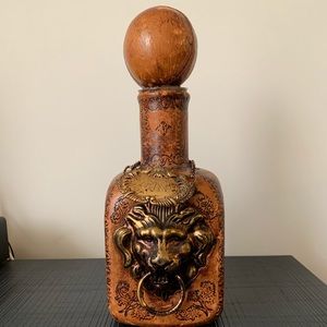 Antique leather wrapped bottle - lion face -gin